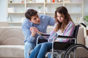 Loss of consortium in Georgia, sad woman in a wheelchair and worried husband