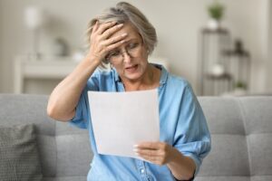 Woman Looking At Car Accident Medical Bills