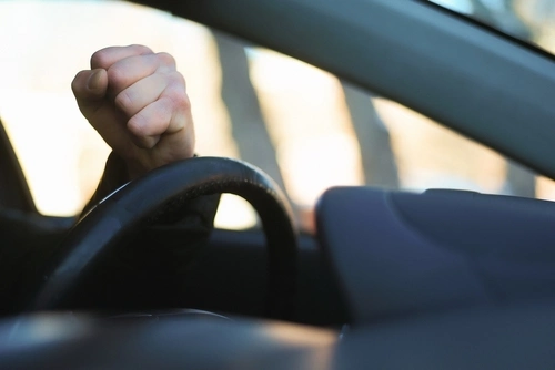Kennesaw aggressive driving accident attorney concept, angry driver honking