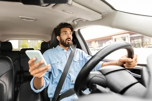 Kennesaw distracted driving accident lawyer concept, texting and driving car crash