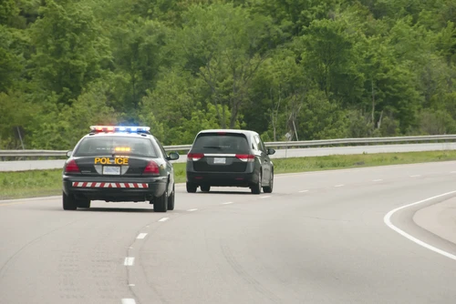 Kennesaw police chase accident lawyer concept, police car in pursuit