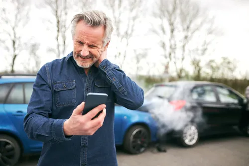 Kennesaw whiplash injury lawyer concept, driver with whiplash from a car accident